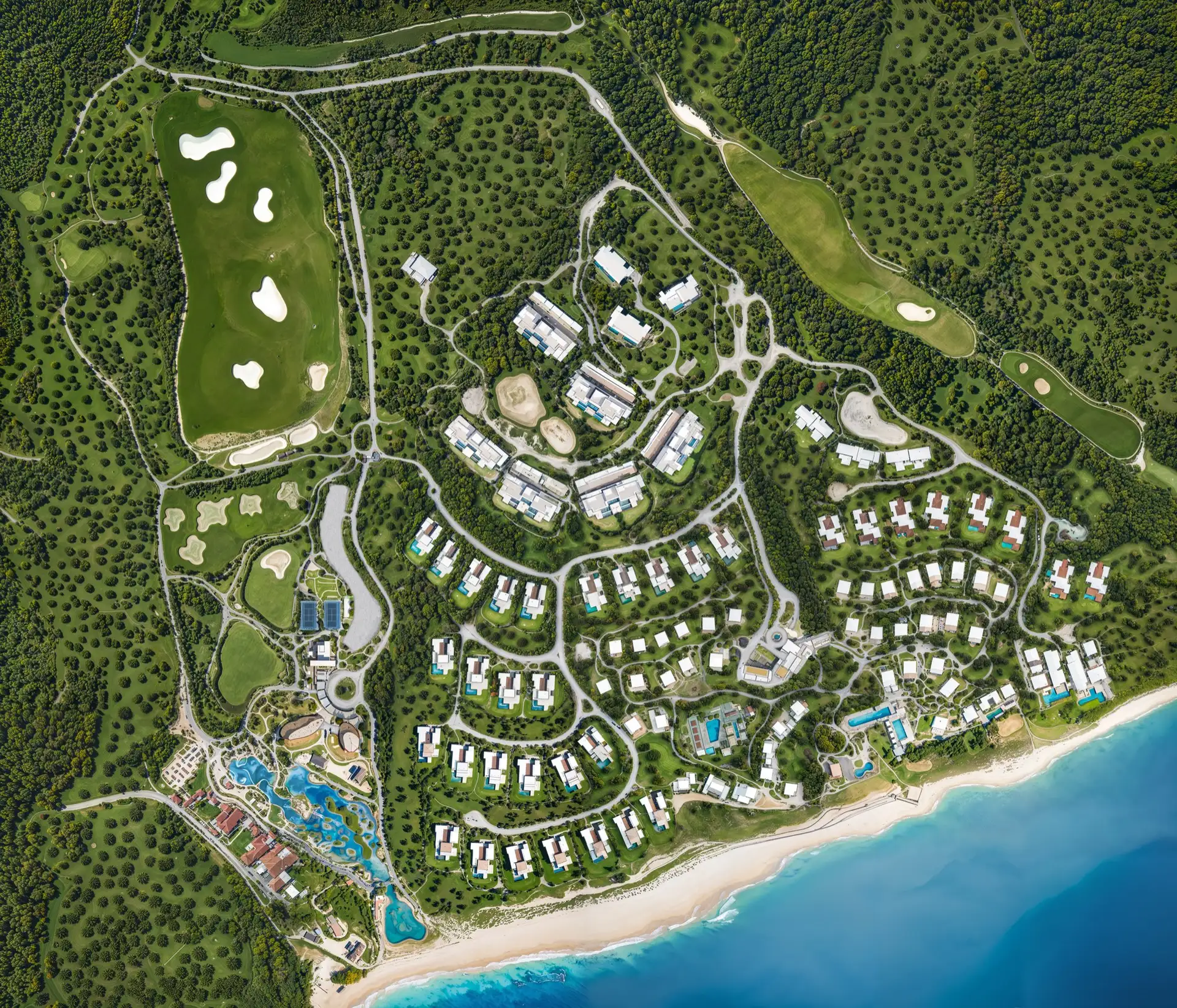 Aerial view of Puerto Los Cabos, showing the golf course, clustered villas, and the coastline surrounding the Grand Reserve Residence.